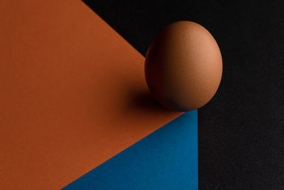 High angle view of orange on table against black background