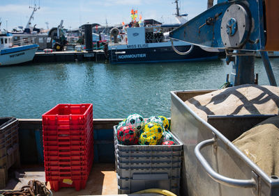 Balls in crate on boat over sea