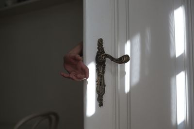 Human hand with closed door
