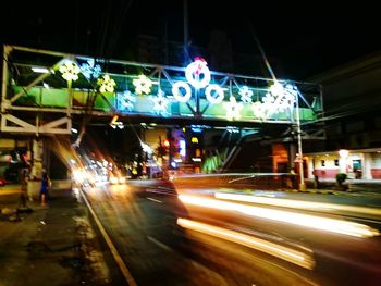 View of illuminated road at night