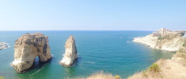 Scenic view of sea against blue sky