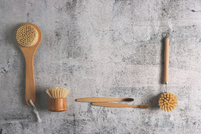 Directly above shot of brushes on concrete table