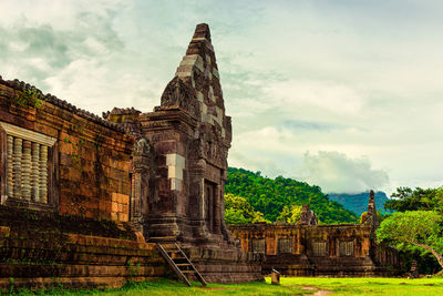 Old ruins of temple against cloudy sky