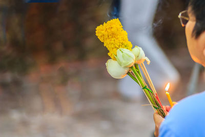 Close-up of woman holding flower bouquet