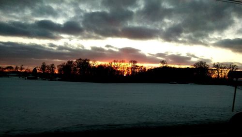 Scenic view of dramatic sky at sunset