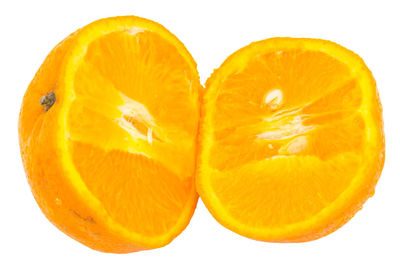 Close-up of orange slice against white background