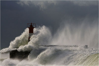 Scenic view of sea against cloudy sky