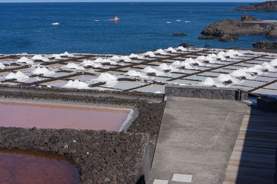 High angle view of sea by swimming pool