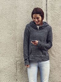 Young woman using cell phone