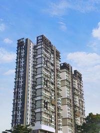 Low angle view of modern buildings against sky