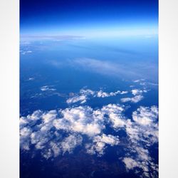 Aerial view of clouds over mountains