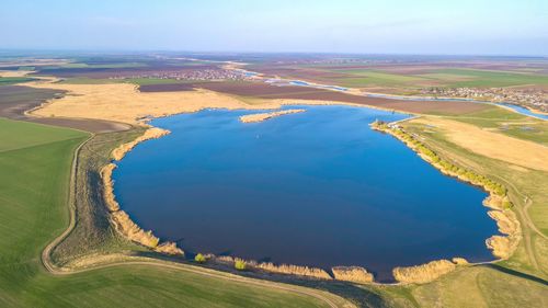 Aerial view of agricultural field against sky