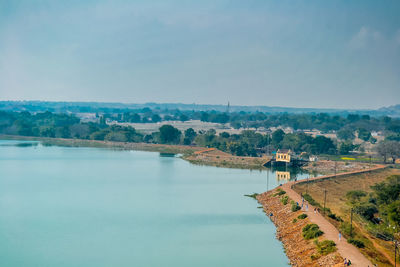 High angle view of river amidst landscape against sky