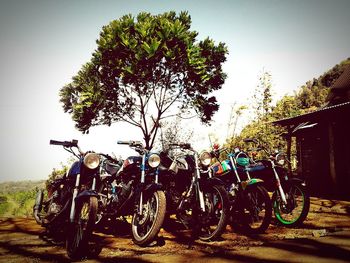 Bicycles parked on road against sky