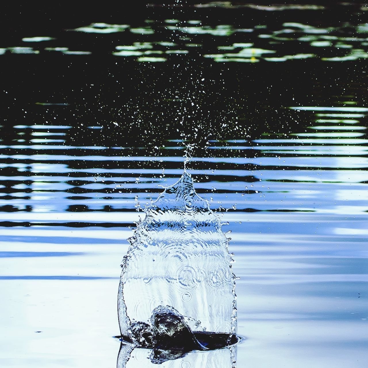 water, drop, reflection, wet, waterfront, transparent, rain, focus on foreground, nature, lake, glass - material, close-up, outdoors, motion, no people, day, rippled, window, fountain