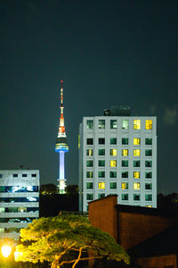 Buildings in city at night