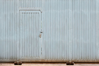 Metal grate of closed door of building