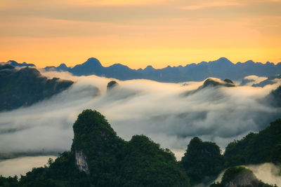 Scenic view of mountains against sky during sunset