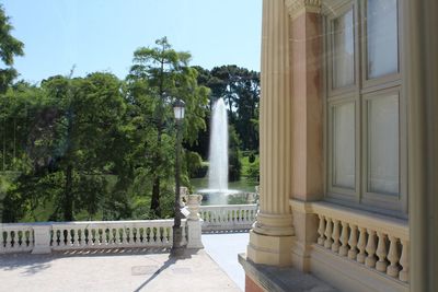 View of historic building seen through window