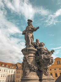 Low angle view of statue against sky