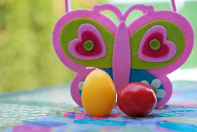 Close-up of multi colored eggs on table