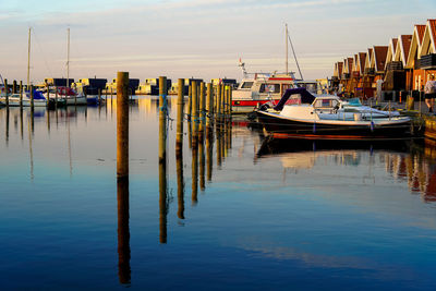 Boats moored at harbor