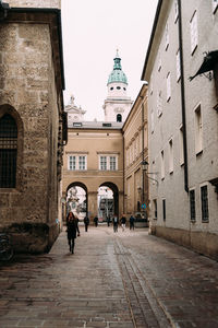 Alley amidst buildings in city