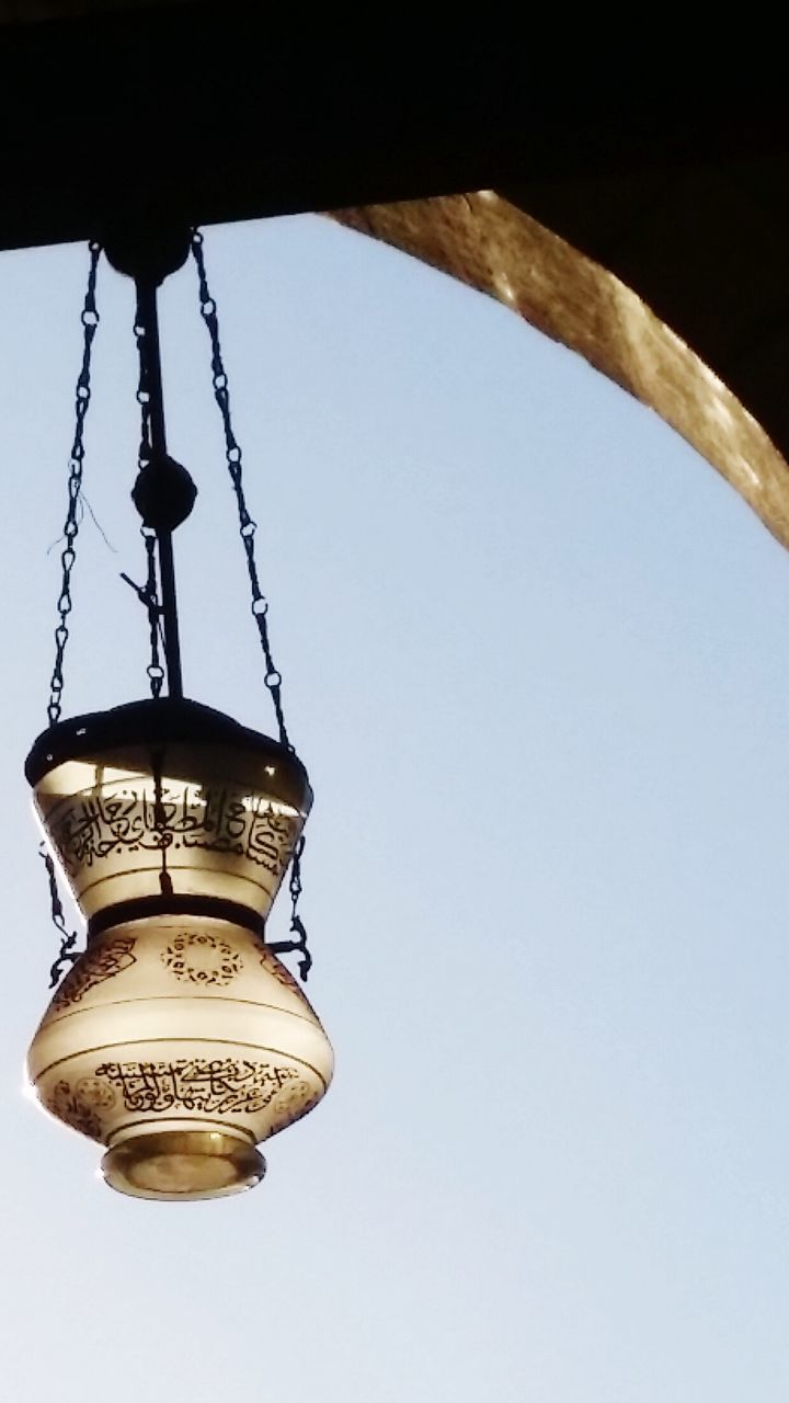 hanging, low angle view, clear sky, no people, chain, outdoors, close-up, day