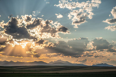 Scenic view of silhouette landscape against sky during sunset