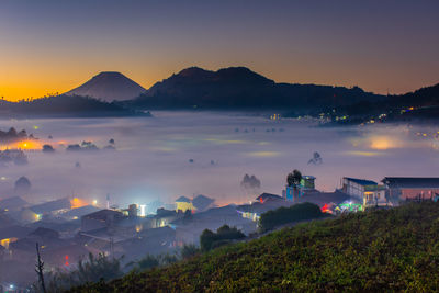 Village view covered with clouds in the morning at dieng palteau, central java, indonesia