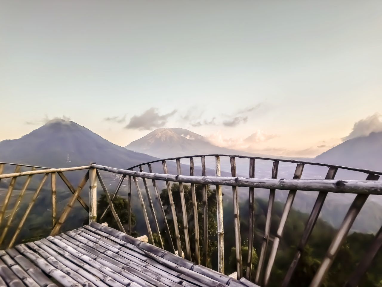 Scenic view of snowcapped mountains against sky during sunset