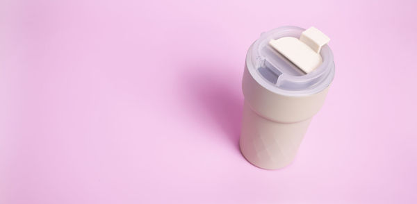 Close-up of usb cable against pink background