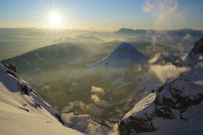 Scenic view of mountains against sky during sunset