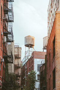 Low angle view of buildings against sky in new york 