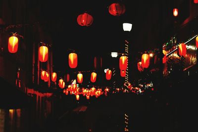 Illuminated lanterns hanging at night