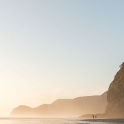 Scenic view of beach against clear sky