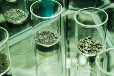 Close-up of glasses and stones on table