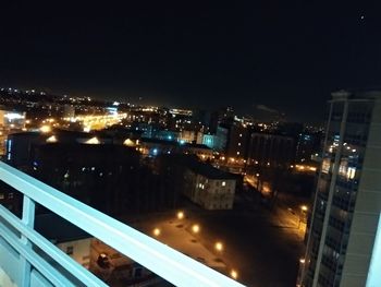 High angle view of illuminated buildings in city at night