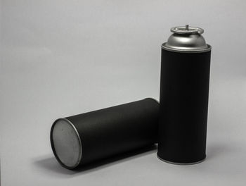 Close-up of bottle on table against white background