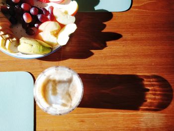 High angle view of breakfast and coffee on sunny table