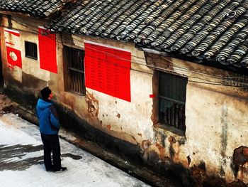 Woman standing in front of building