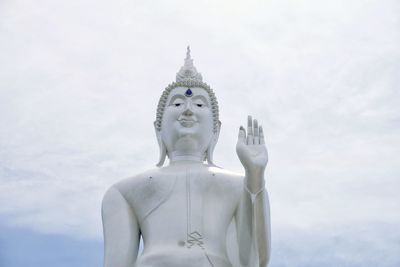 Low angle view of statue against sky