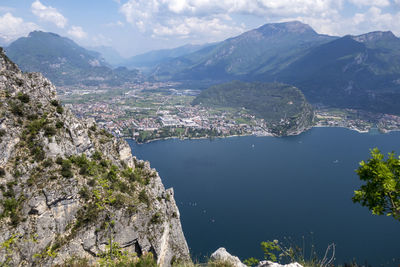 Scenic view of sea and mountains against sky