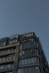 Low angle view of office building against sky