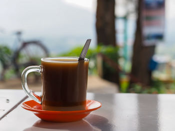 Close-up of coffee cup on table