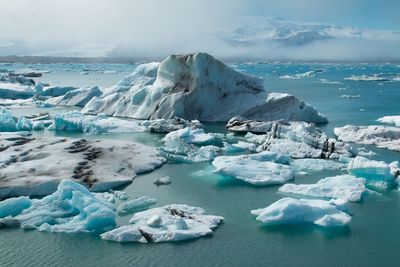 Scenic view of frozen sea against sky