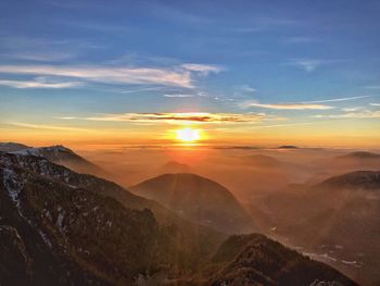 Scenic view of mountains against sky during sunset