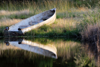 Boat moored in lake