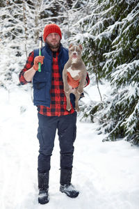 Full length of woman standing on snow