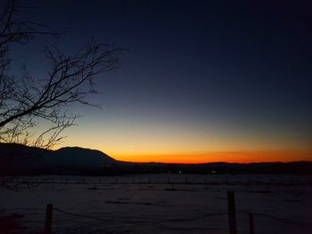 Scenic view of sunset over lake